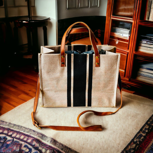 Black Stripe Jute Tote Bag with a brown leather handle and shoulder strap